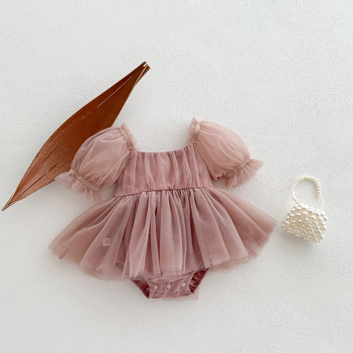 A cute Spring and Summer Baby Girls Short Sleeves Solid Color Mesh Dress in white and pink, perfect for warm weather.