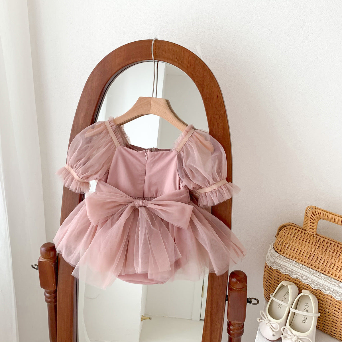 A cute Spring and Summer Baby Girls Short Sleeves Solid Color Mesh Dress in white and pink, perfect for warm weather.