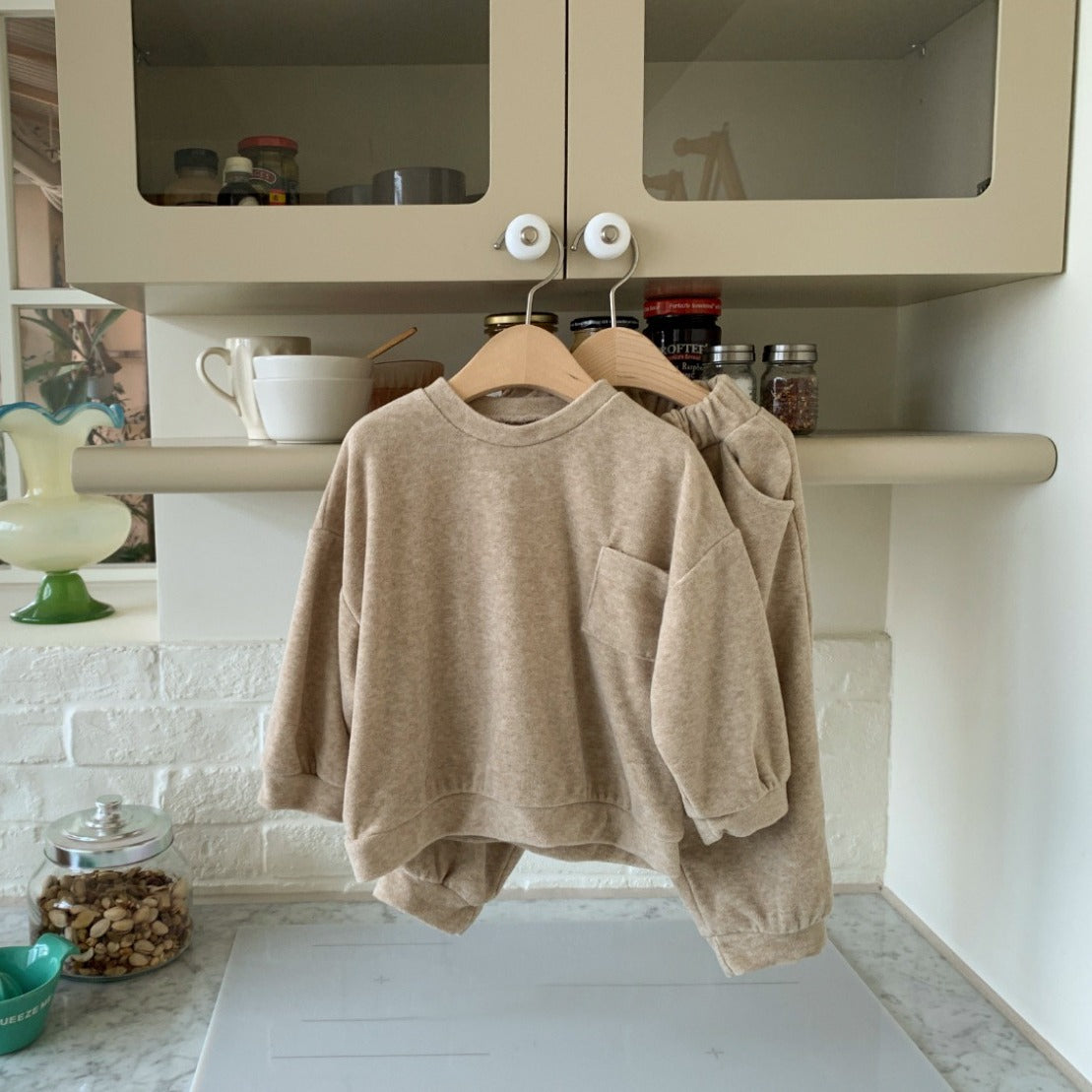 Spring Baby and Kids Unisex Solid Color Pullover Top in apricot and coffee colors, featuring a pocket and made from soft viscose fiber.