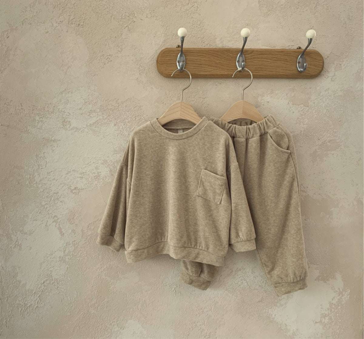 Spring Baby and Kids Unisex Solid Color Pullover Top in apricot and coffee colors, featuring a pocket and made from soft viscose fiber.