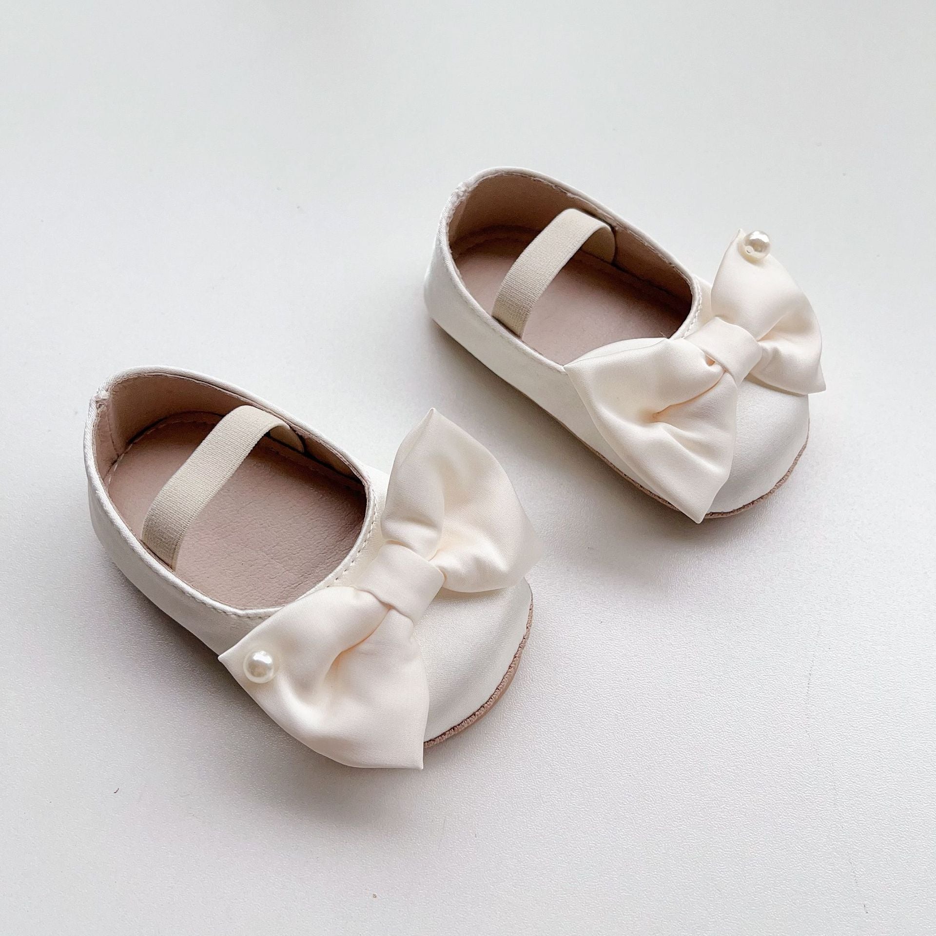 Spring Baby Girl Big Bow Toddler Soft-Sole Anti-Slip Walking Shoes in white, black, and pink colors with a stylish big bow.