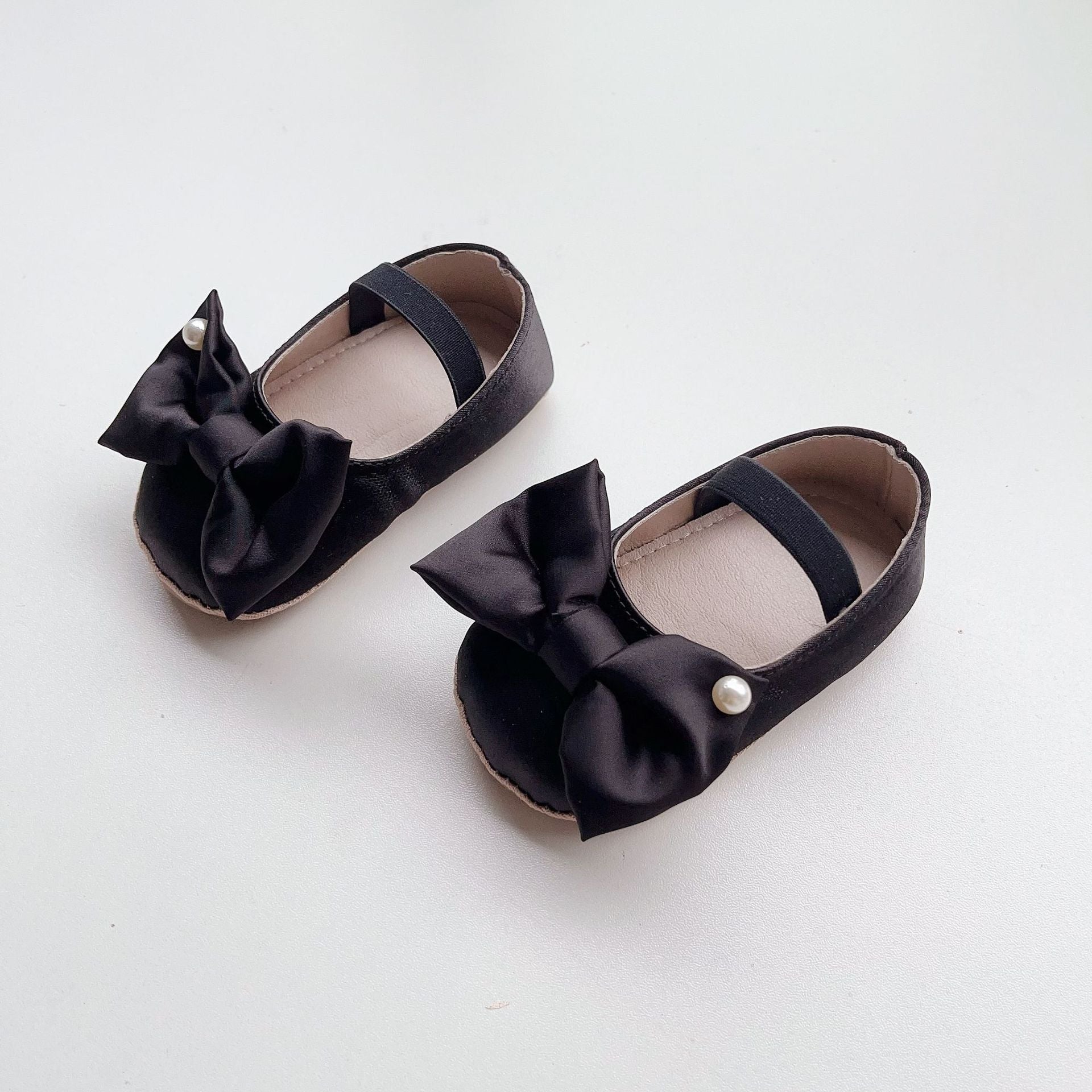 Spring Baby Girl Big Bow Toddler Soft-Sole Anti-Slip Walking Shoes in white, black, and pink colors with a stylish big bow.