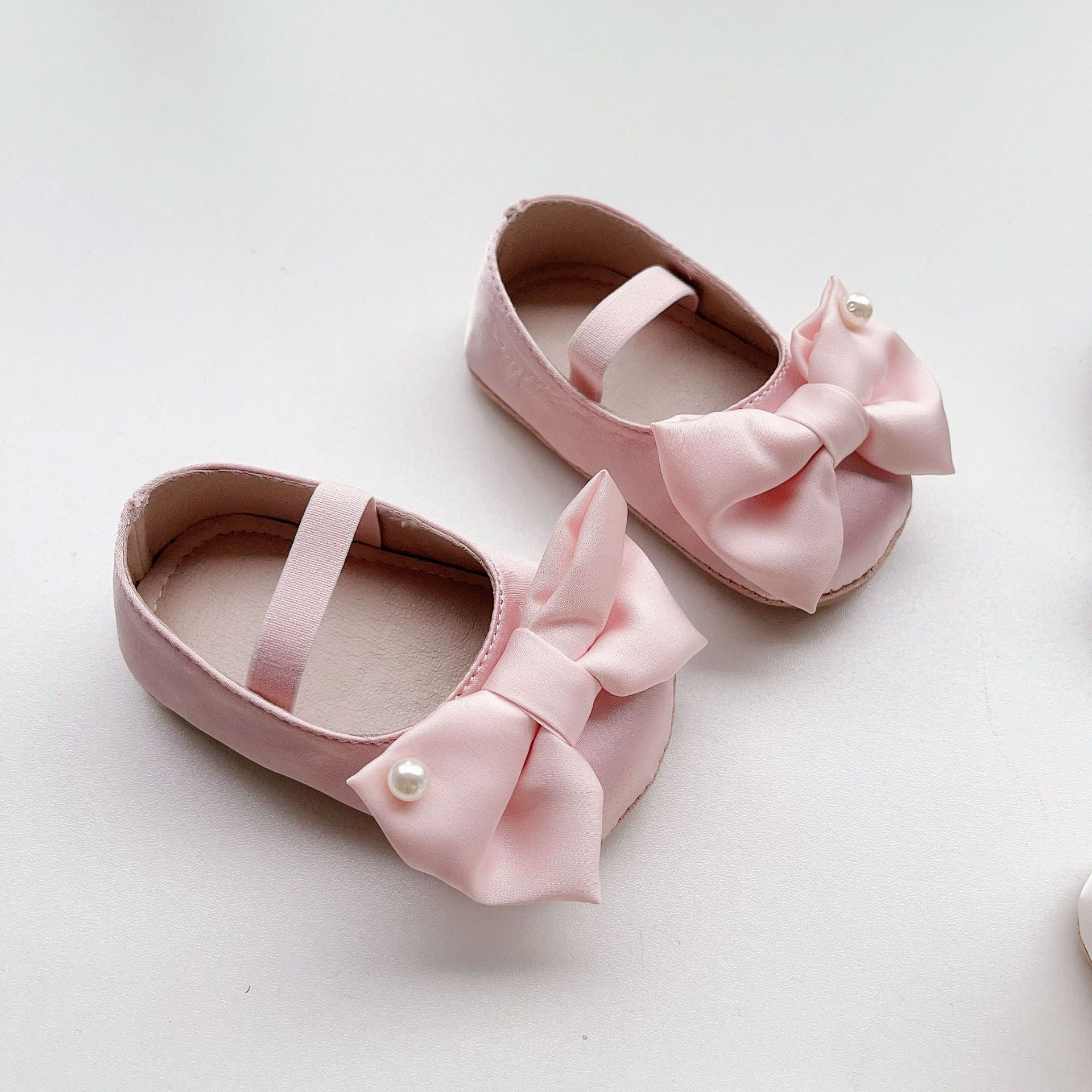 Spring Baby Girl Big Bow Toddler Soft-Sole Anti-Slip Walking Shoes in white, black, and pink colors with a stylish big bow.