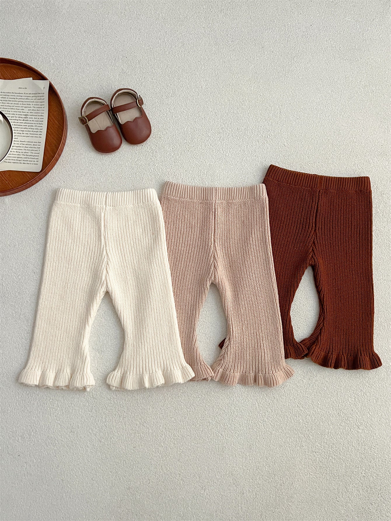 Spring Baby Girls Elastic Flared Knit Floral Lace Pants in white, khaki, and brown colors, showcasing floral lace details and elastic waistband.