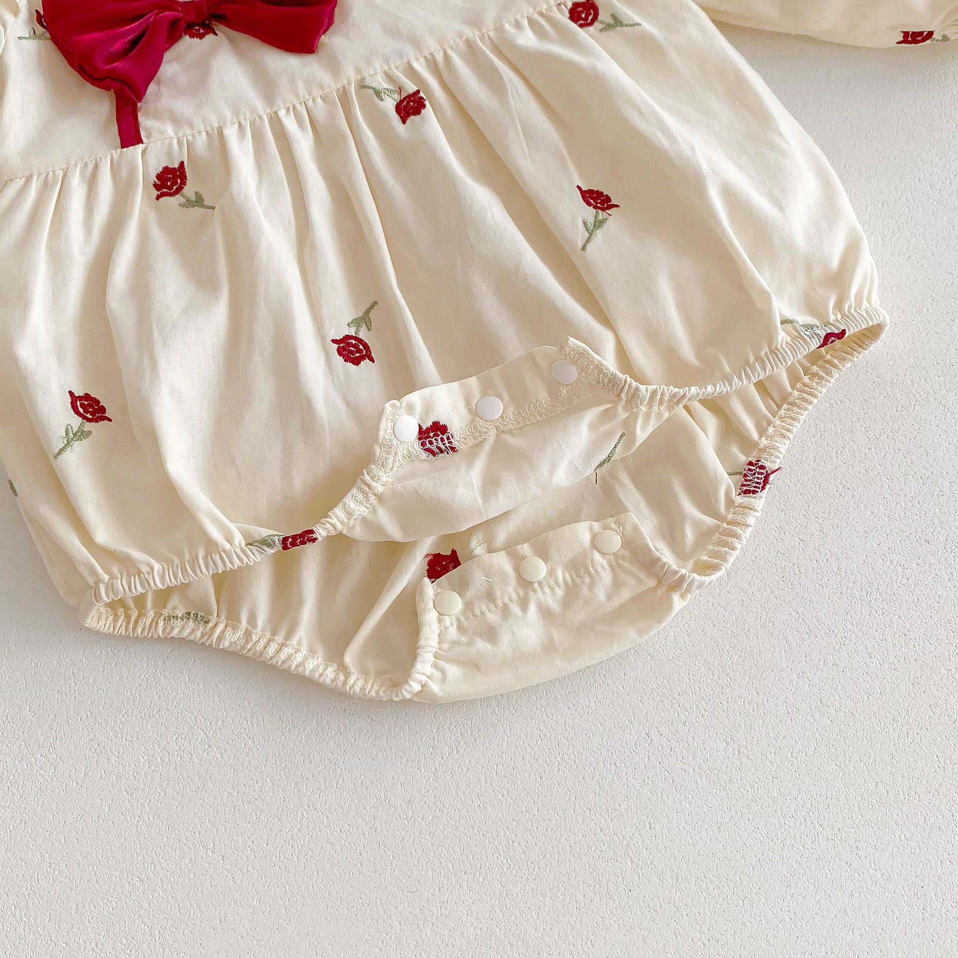 Spring Baby Girls Long Sleeves Floral Rose Print Onesie in beige, featuring a beautiful floral design, perfect for spring and autumn wear.