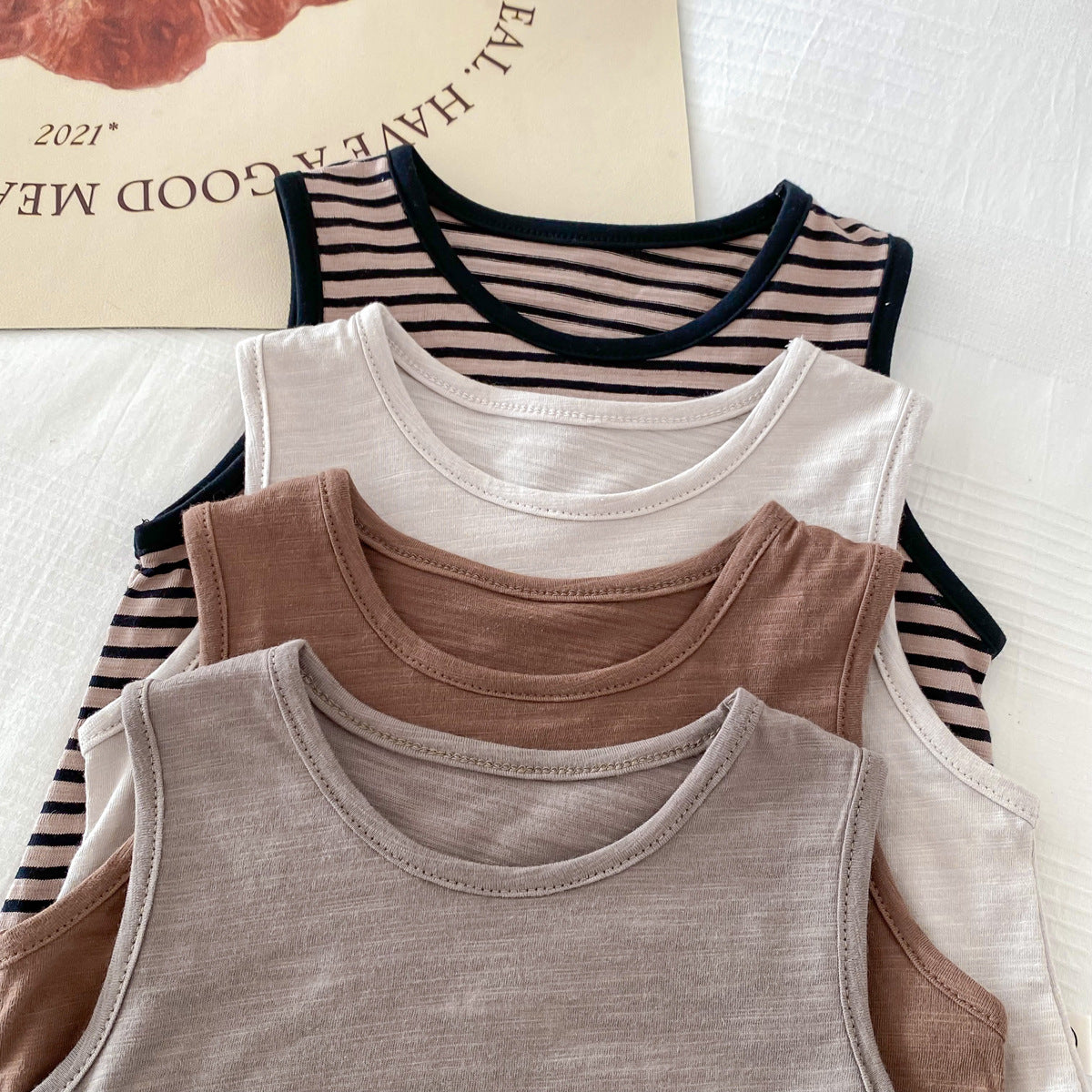 Spring Baby Kids Unisex Top Sleeveless Vest and Shorts Clothing Set in Grey, Khaki, Beige, and Coffee colors, suitable for boys and girls.