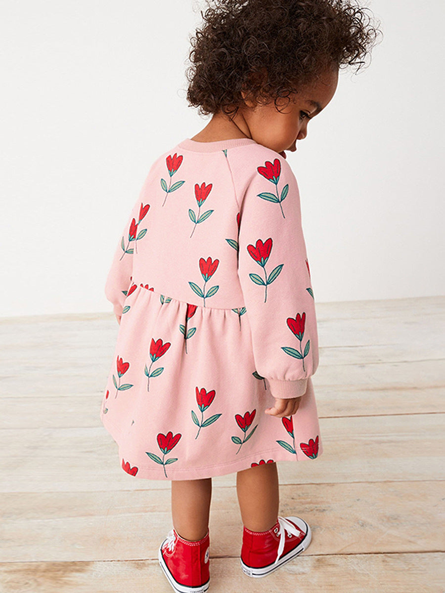 A beautiful pink long sleeve dress for girls featuring a floral pattern, perfect for spring and autumn wear.