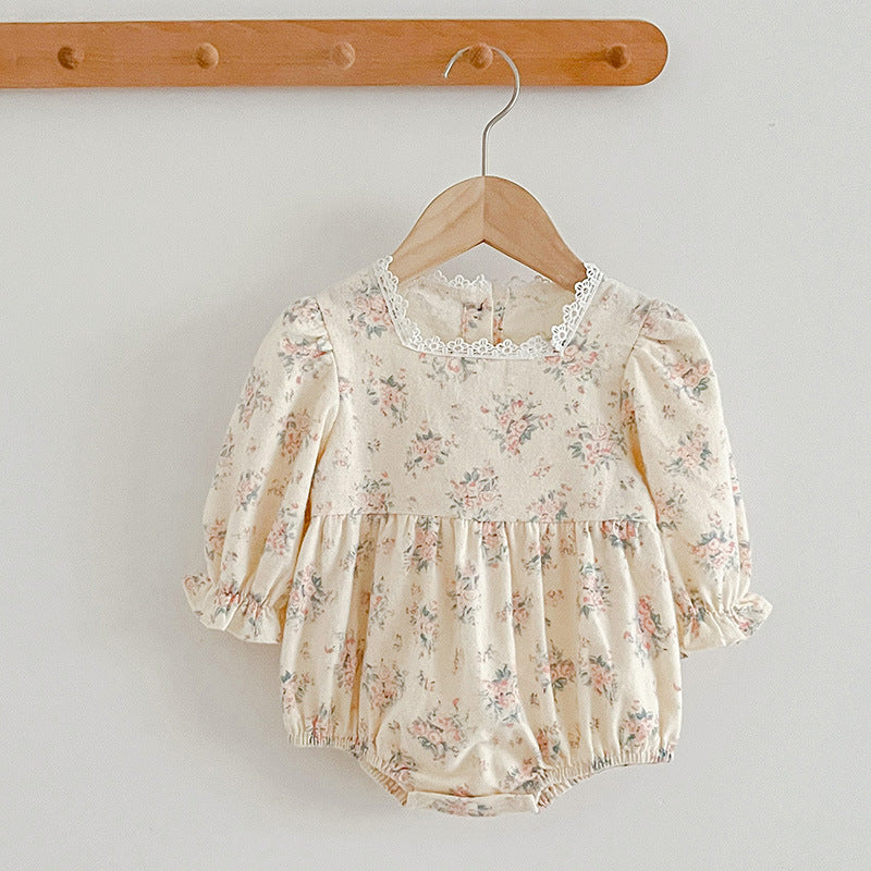 A stylish square neck baby onesie in white and beige, featuring floral embroidery, perfect for baby girls.