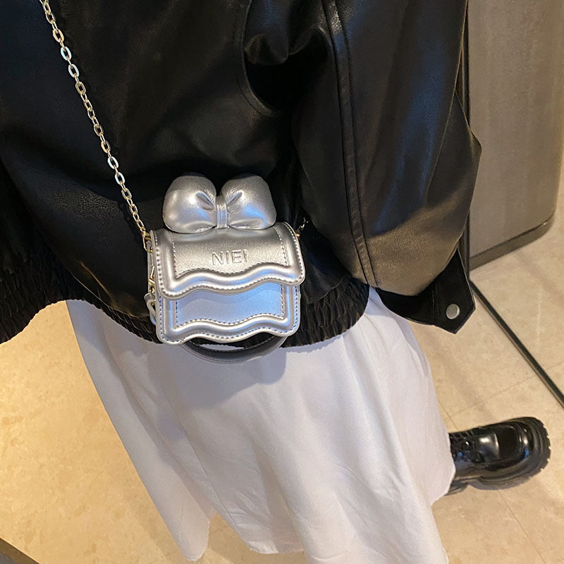 Stylish Mini Carry-On Girls’ Portable Big Bow Princess Crossbody bag in vibrant colors with a large bow detail.