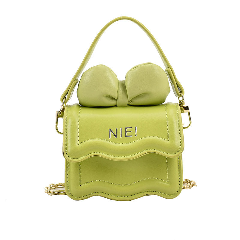 Stylish Mini Carry-On Girls’ Portable Big Bow Princess Crossbody bag in vibrant colors with a large bow detail.