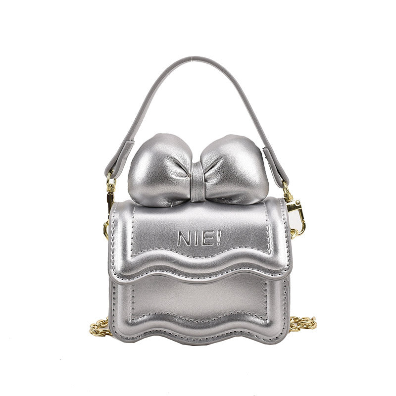 Stylish Mini Carry-On Girls’ Portable Big Bow Princess Crossbody bag in vibrant colors with a large bow detail.