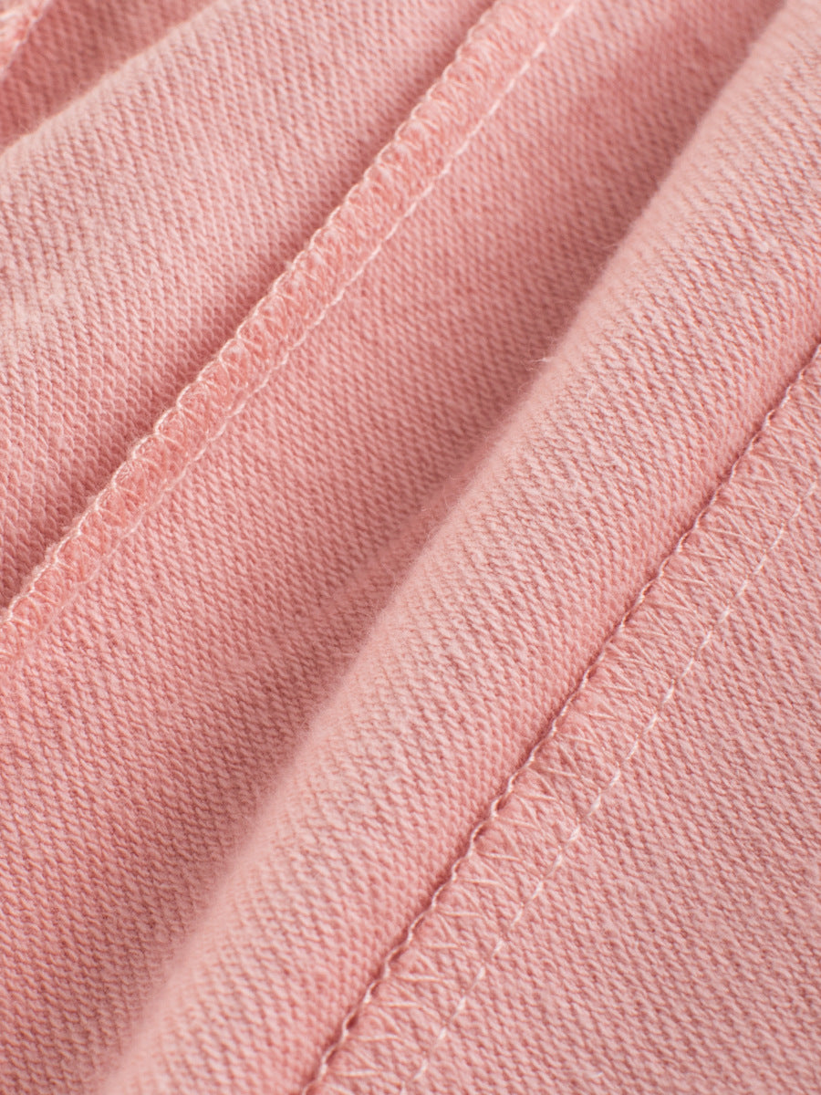 A cute summer outfit for baby girls featuring a breathable cotton fabric with a playful catty face pattern in pink.