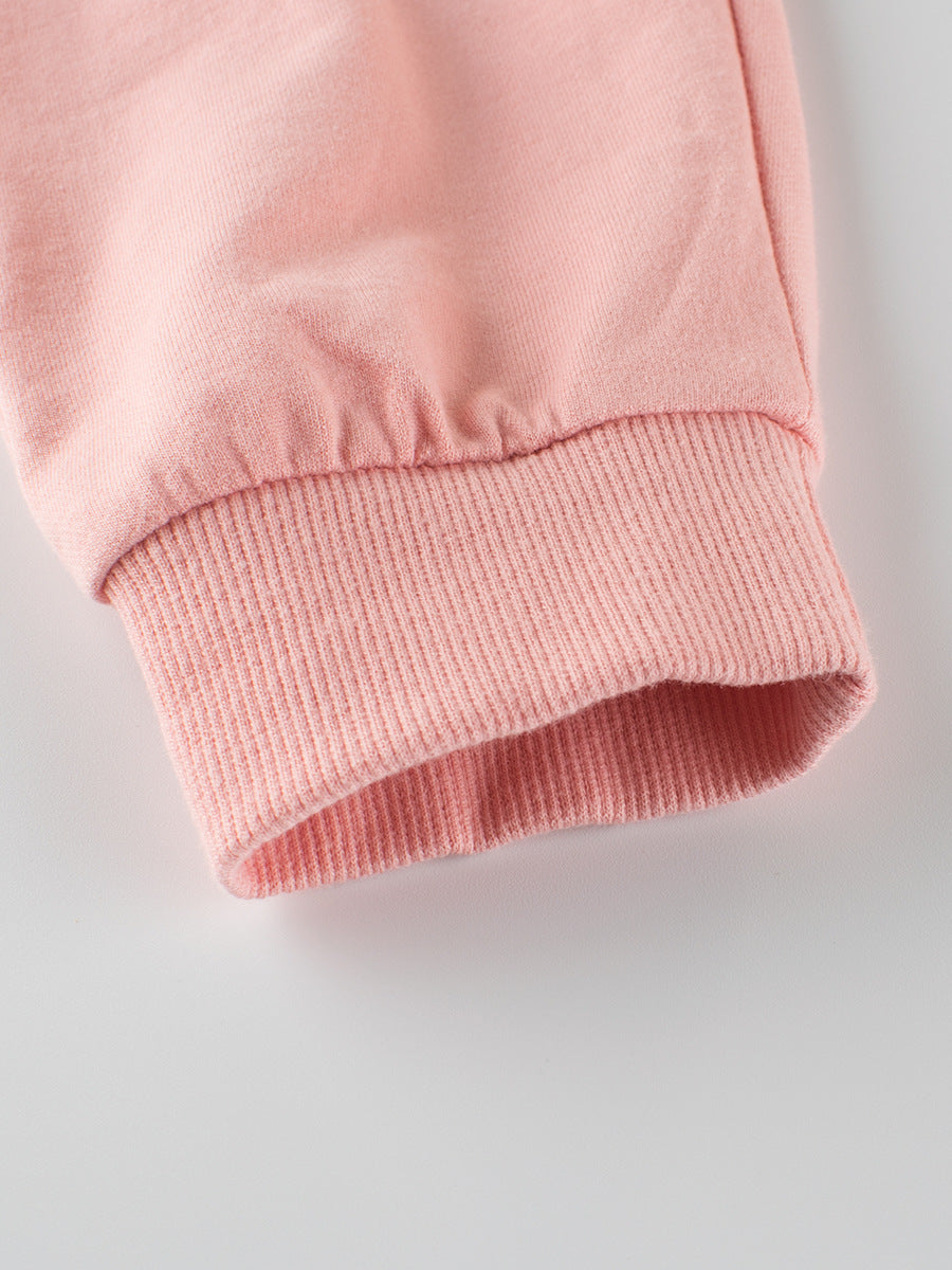 A cute summer outfit for baby girls featuring a breathable cotton fabric with a playful catty face pattern in pink.