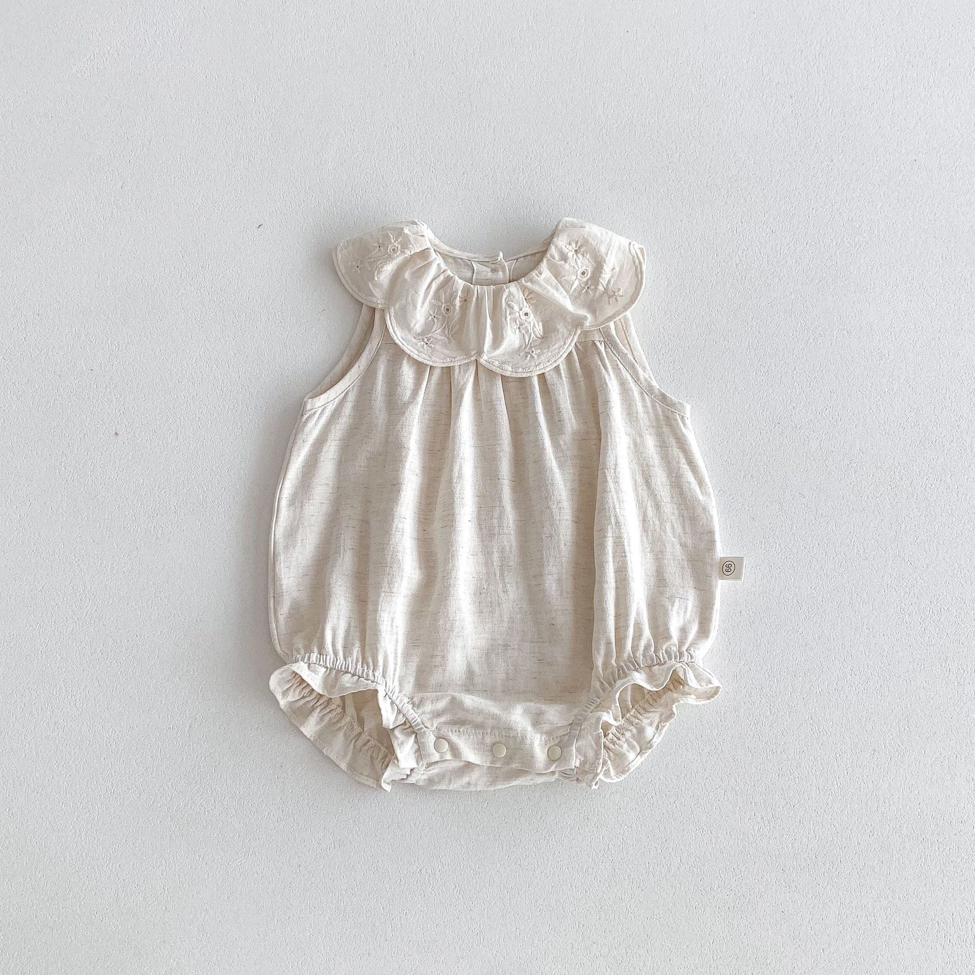 Summer Baby Girls Solid Color Simple Floral Embroidery Sleeveless dress in white, featuring delicate floral embroidery and a sleeveless design.