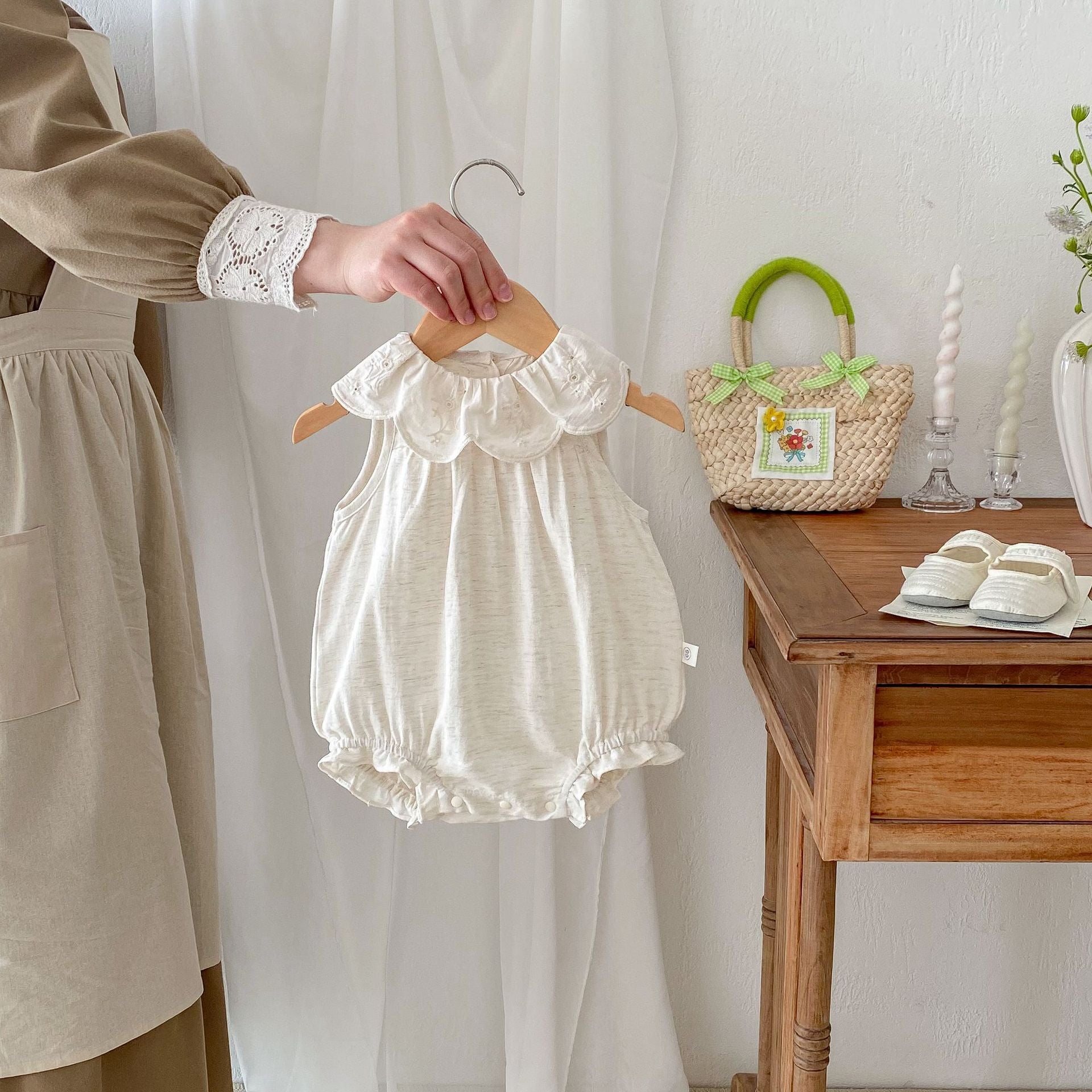 Summer Baby Girls Solid Color Simple Floral Embroidery Sleeveless dress in white, featuring delicate floral embroidery and a sleeveless design.