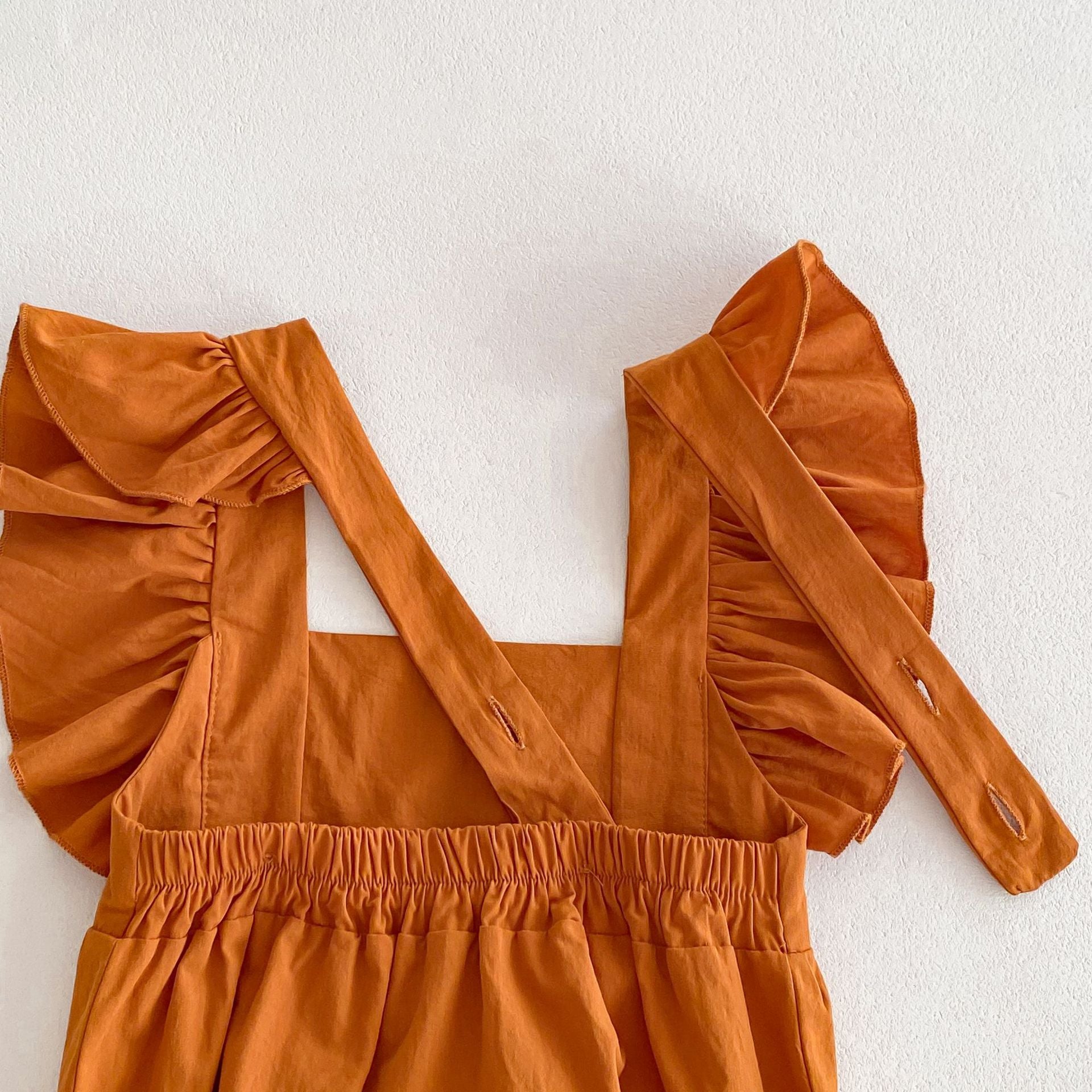 Summer Baby Girls Solid Color Square Neck Onesie in various colors, showcasing its soft fabric and stylish design.