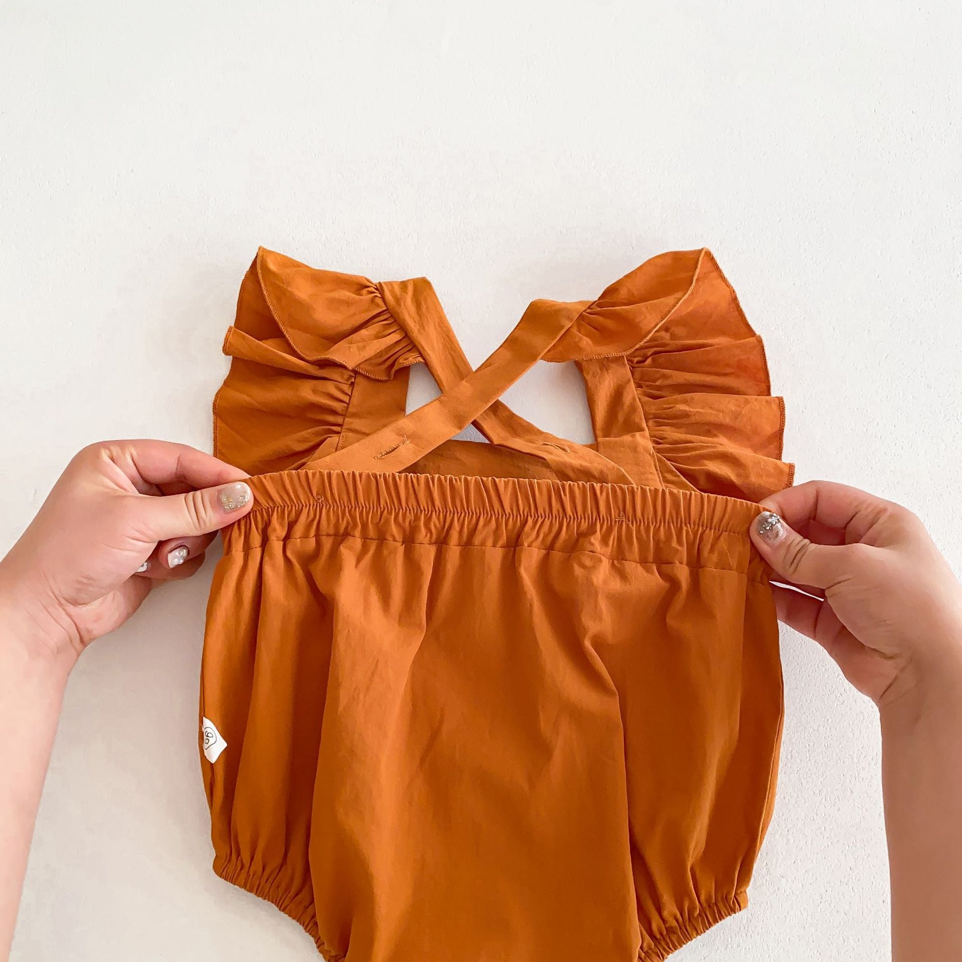 Summer Baby Girls Solid Color Square Neck Onesie in various colors, showcasing its soft fabric and stylish design.