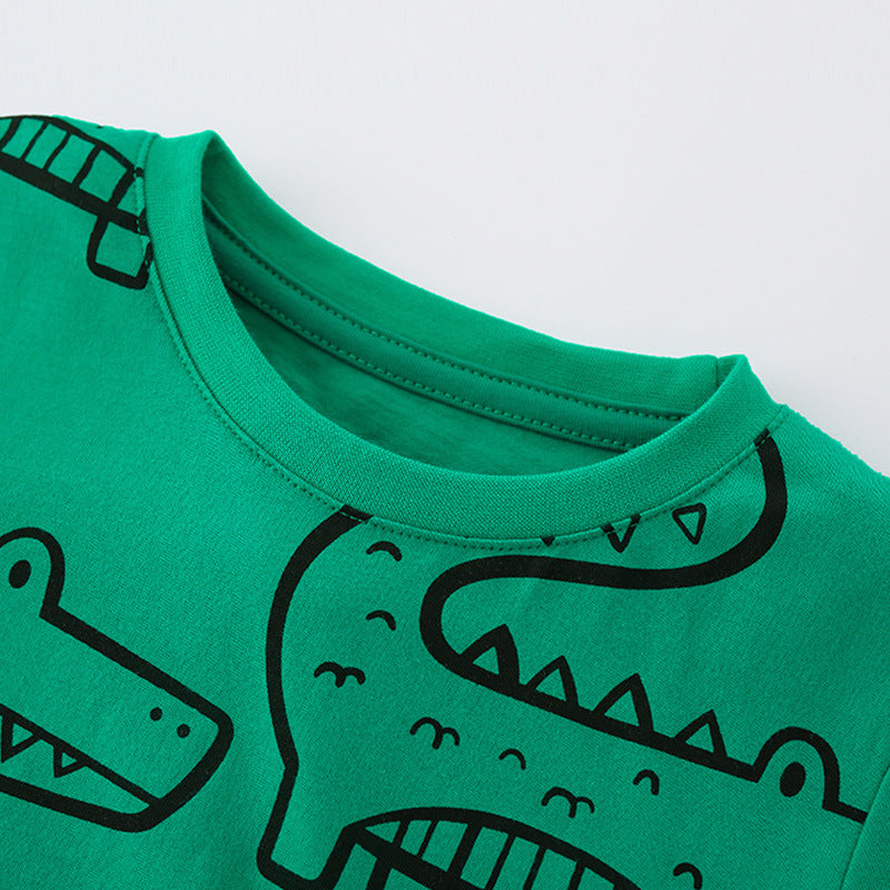 Green Summer T-Shirt for Boys featuring a playful crocodile cartoon print, made from soft cotton material.