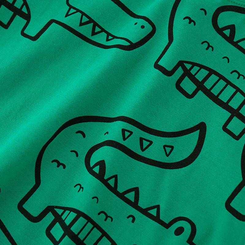 Green Summer T-Shirt for Boys featuring a playful crocodile cartoon print, made from soft cotton material.