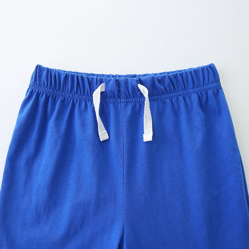 Summer Baby Kids Boys T-Shirt and Shorts set featuring a colorful dinosaur cartoon print on a white background, perfect for summer wear.