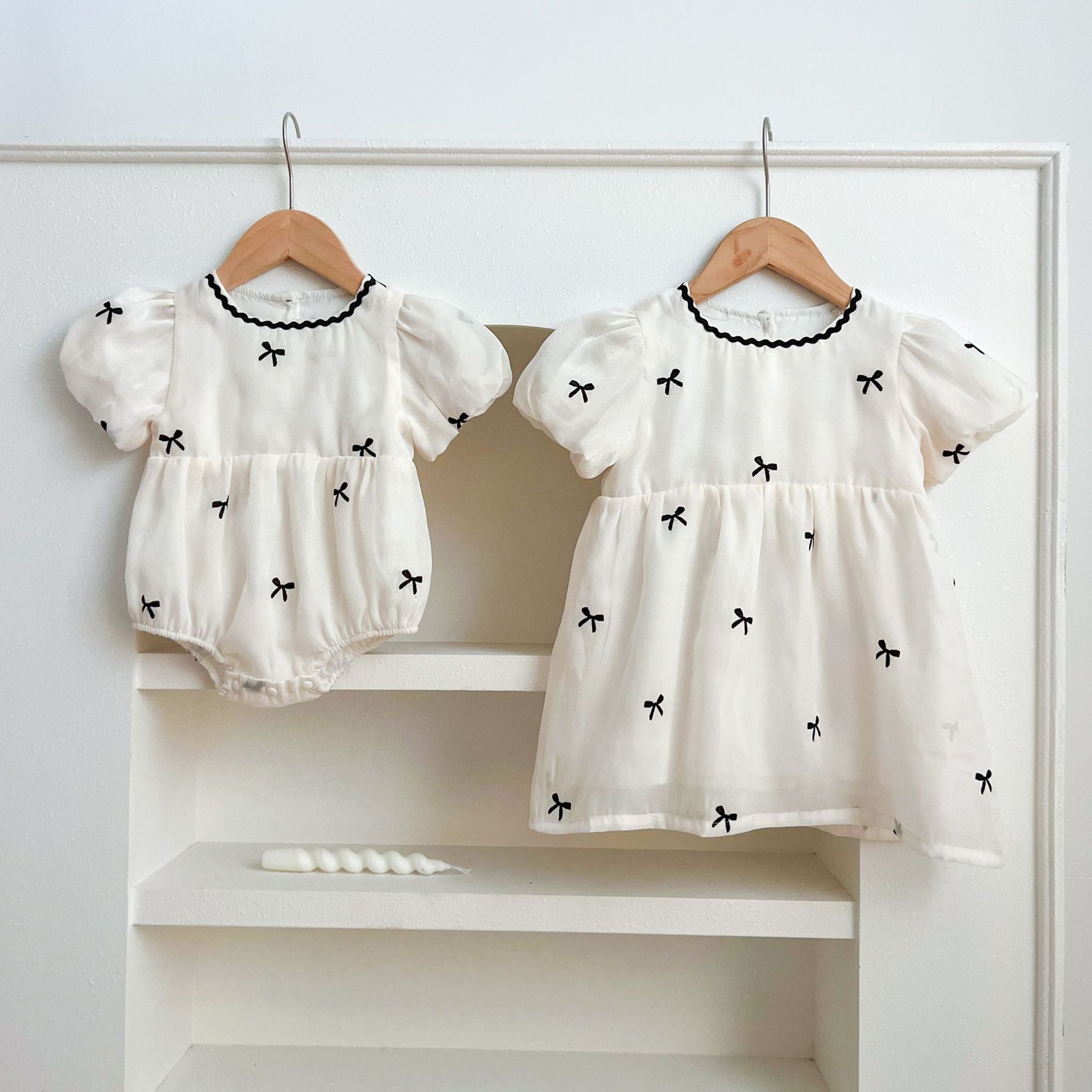 Summer Baby Kids Girls top featuring butterfly bows pattern, short sleeves, and crew neck in beige and apricot colors.