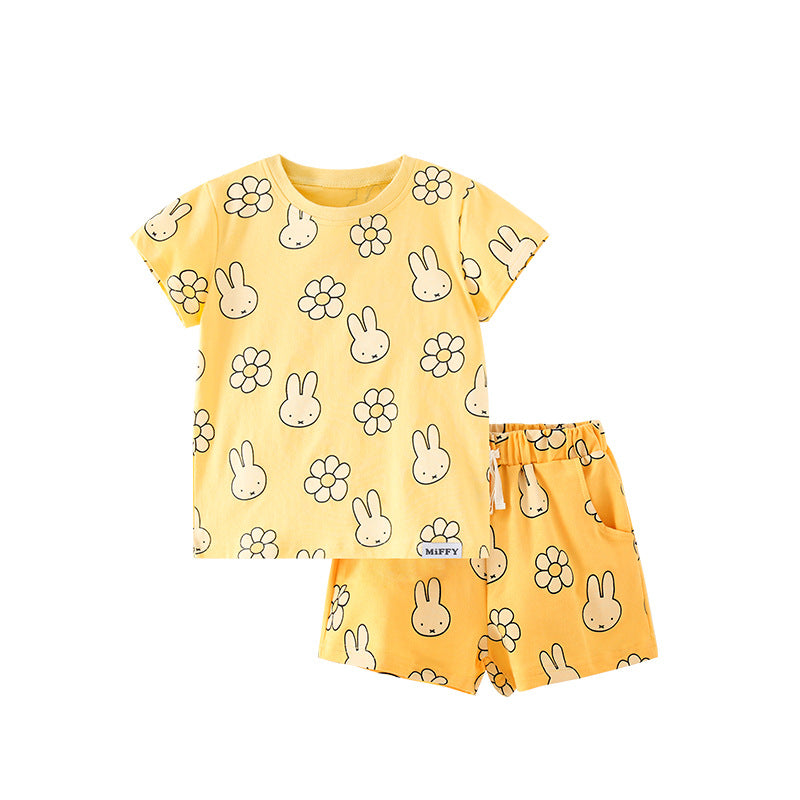 Bright yellow summer t-shirt for girls featuring a cartoon rabbit and flowers pattern, made from soft cotton material.