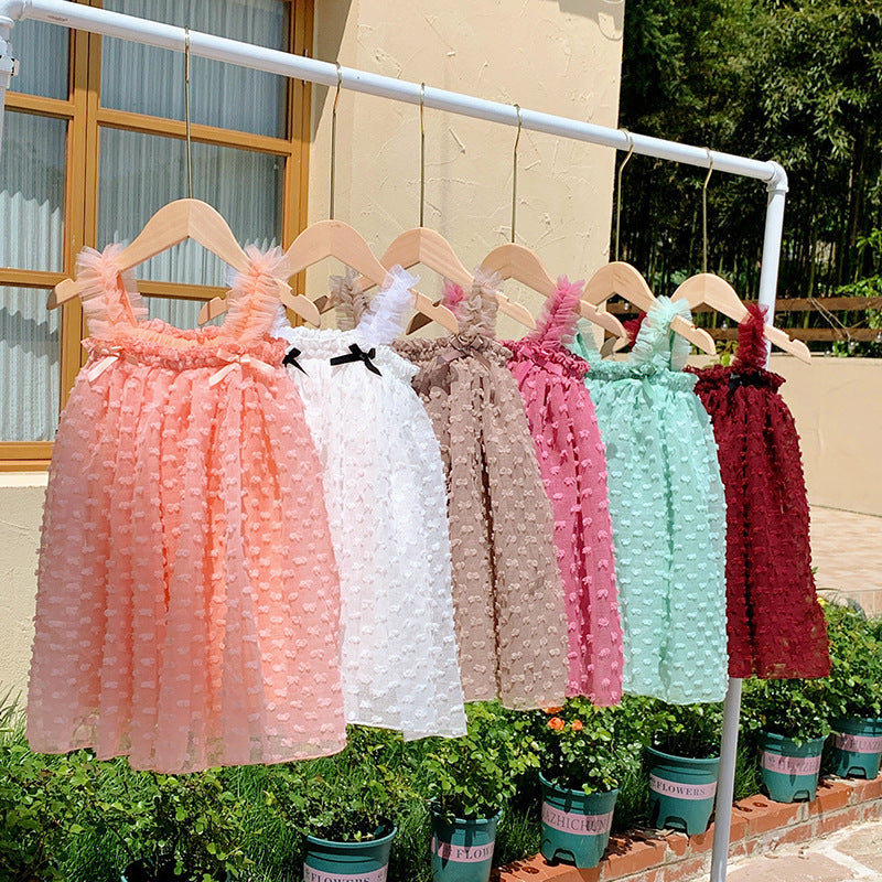 A cute summer dress for girls featuring a sleeveless design and 3D butterfly bows, available in multiple colors.