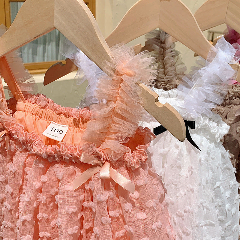 A cute summer dress for girls featuring a sleeveless design and 3D butterfly bows, available in multiple colors.