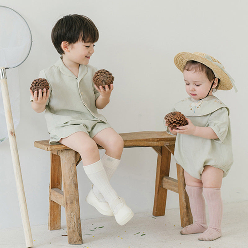 Summer Baby Kids Unisex Simple V Neck Top Shirt in green and beige colors, made from soft cotton, suitable for boys and girls.