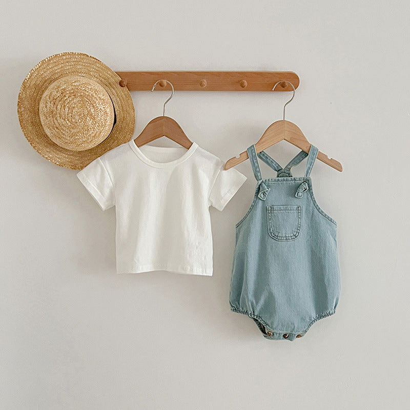 Summer Baby Kids Unisex Solid Color White Short Sleeves T-Shirt displayed on a hanger, showcasing its soft fabric and short sleeves.