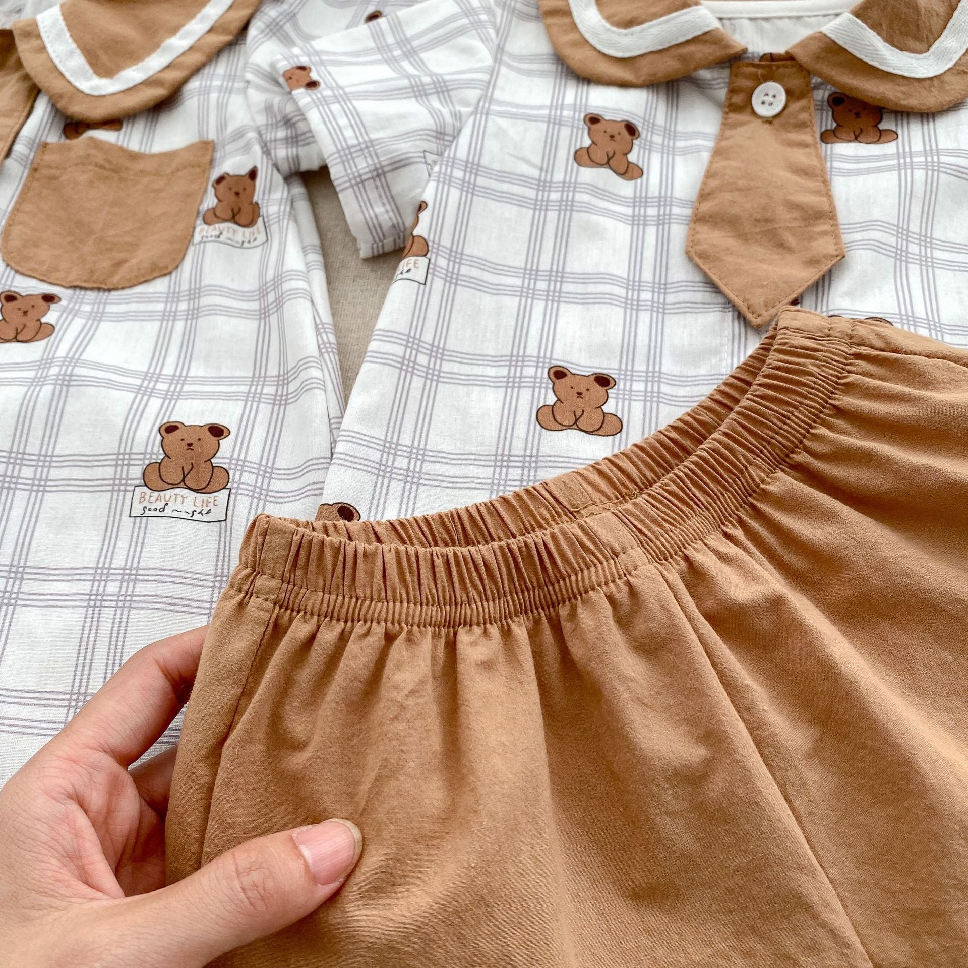 Summer Baby Teddy Pattern Plaid Short-Sleeved Romper in white and brown colors, featuring a cute teddy design, perfect for infants and toddlers.