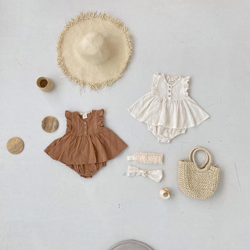 A beige summer dress for baby girls featuring fly sleeves, made from soft cotton, perfect for warm weather.