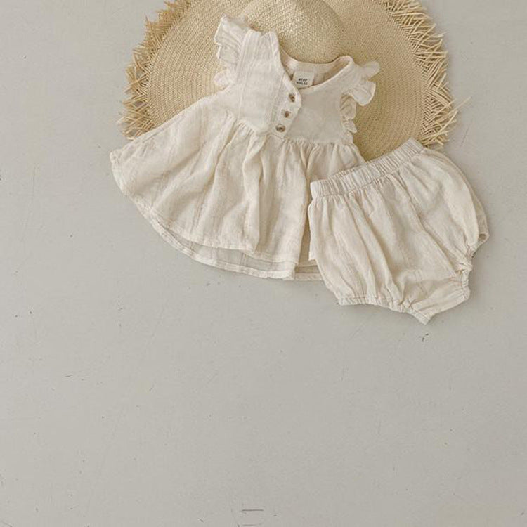 A beige summer dress for baby girls featuring fly sleeves, made from soft cotton, perfect for warm weather.