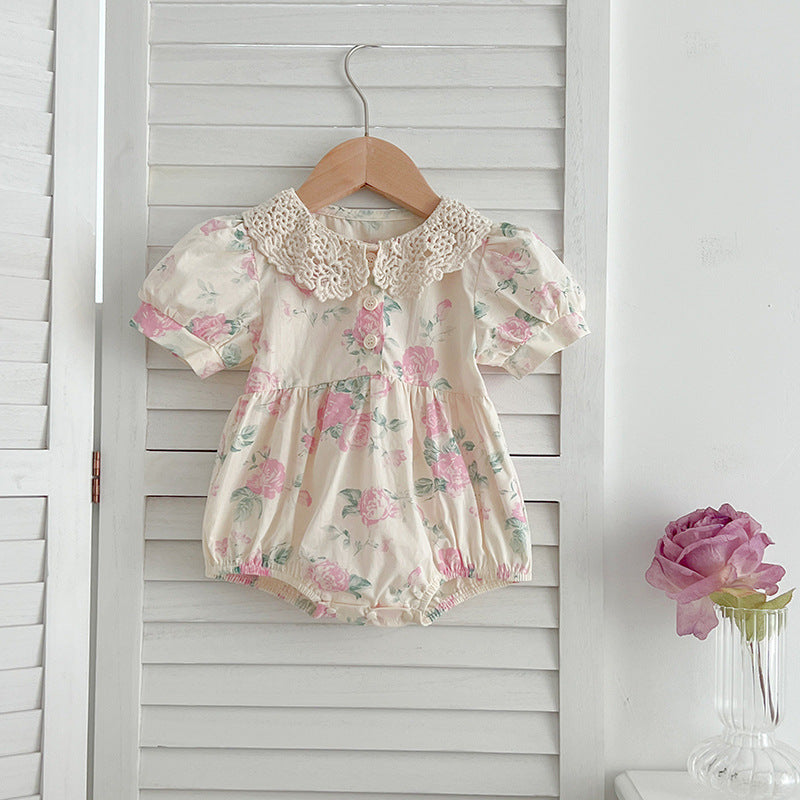 A cute summer dress for girls featuring a floral pattern and a hollow out Peter Pan collar, available in pink and beige.