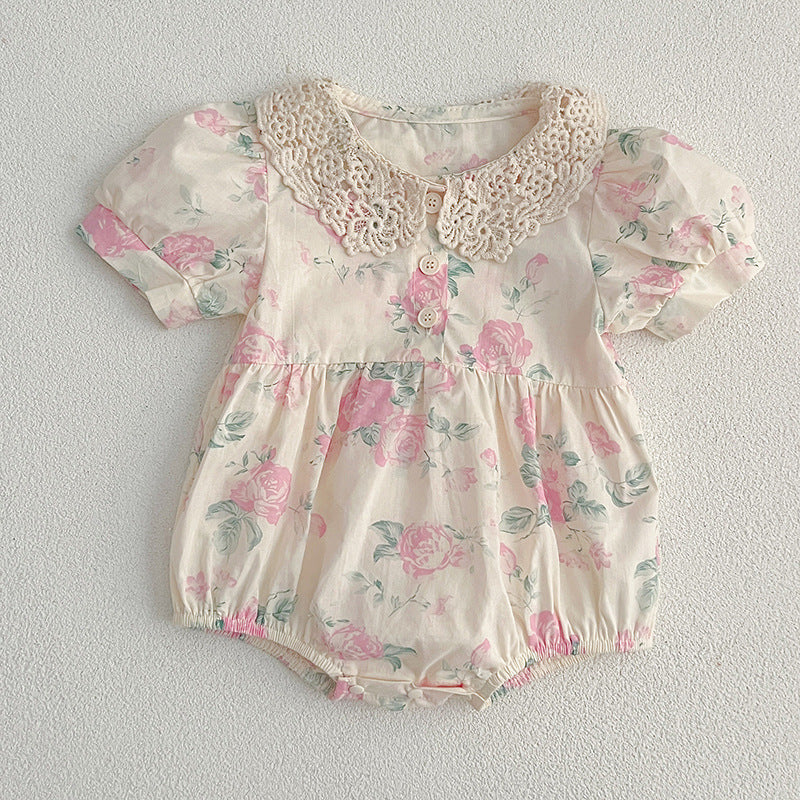 A cute summer dress for girls featuring a floral pattern and a hollow out Peter Pan collar, available in pink and beige.