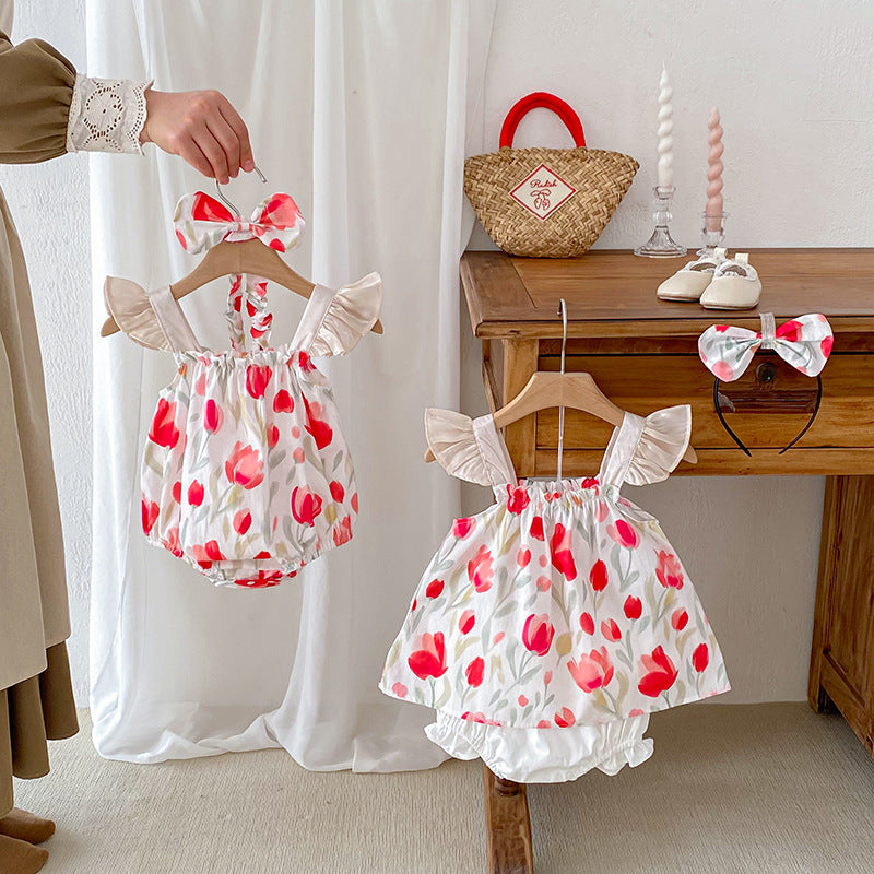 A vibrant summer outfit featuring a floral pattern, sleeveless design, and straps, suitable for baby girls and young girls.