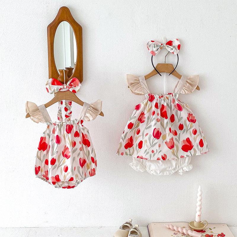 A vibrant summer outfit featuring a floral pattern, sleeveless design, and straps, suitable for baby girls and young girls.