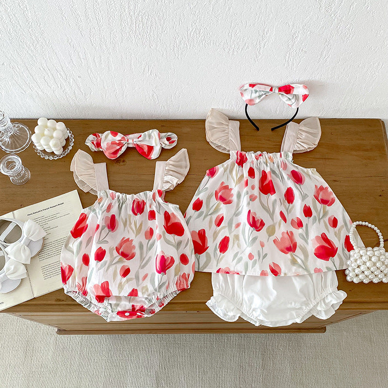 A vibrant summer outfit featuring a floral pattern, sleeveless design, and straps, suitable for baby girls and young girls.