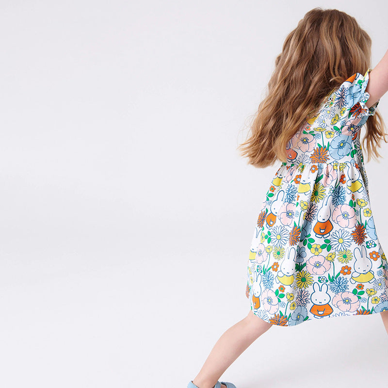 A vibrant yellow summer dress for girls featuring a floral print and a Peter Pan collar, perfect for warm weather outings.
