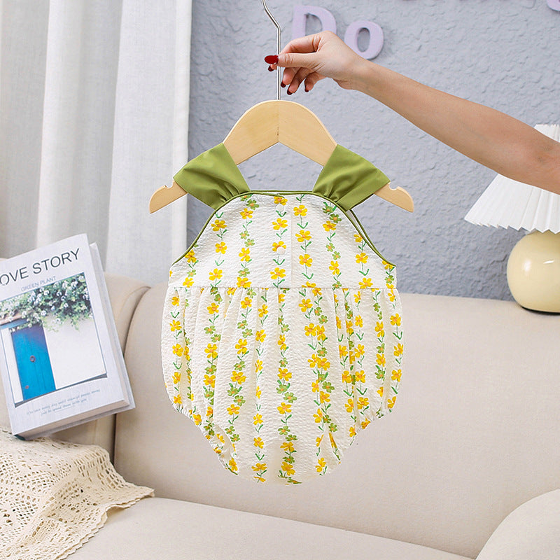 A bright yellow floral pattern sleeveless strap onesie for girls, showcasing vibrant flowers on a soft fabric.