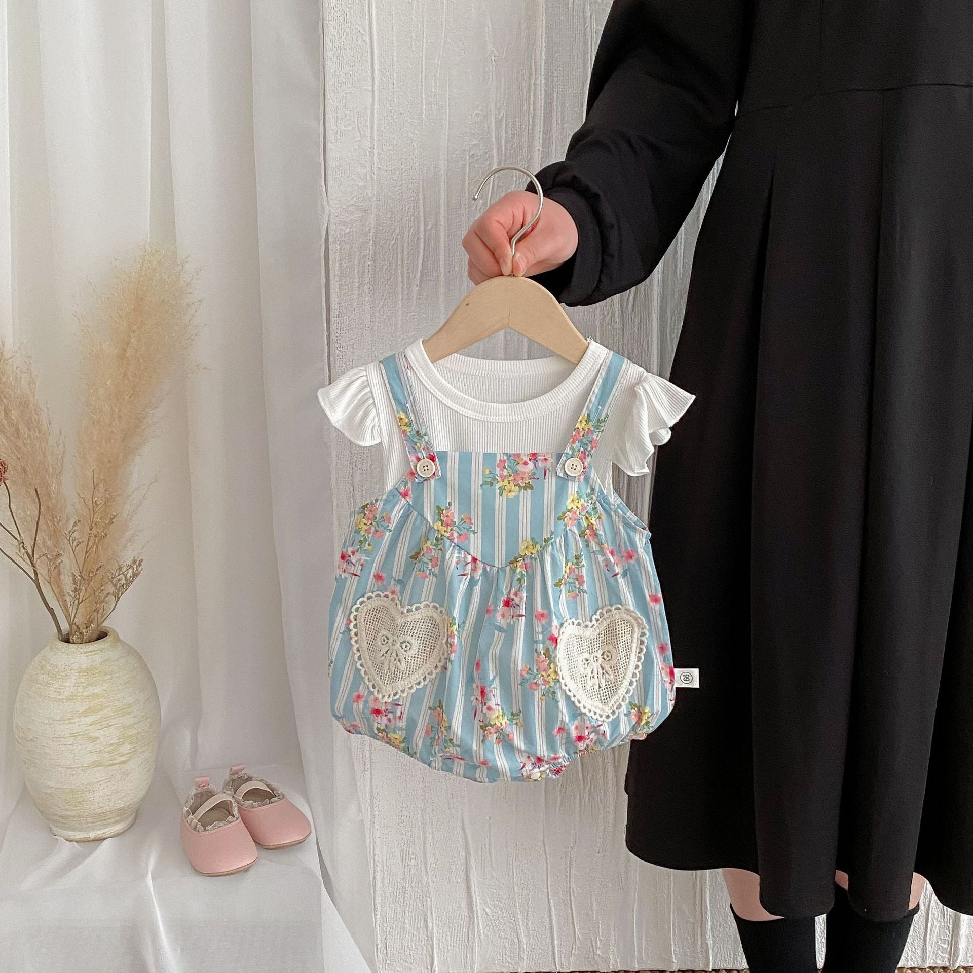 Summer baby girls sleeveless floral pattern strap onesies in blue, made from soft cotton, perfect for warm weather.