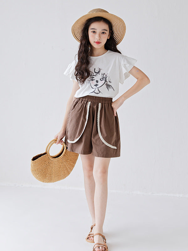 White girls t-shirt featuring a colorful cartoon print, perfect for summer wear.