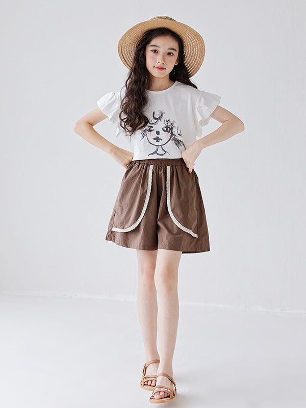 White girls t-shirt featuring a colorful cartoon print, perfect for summer wear.