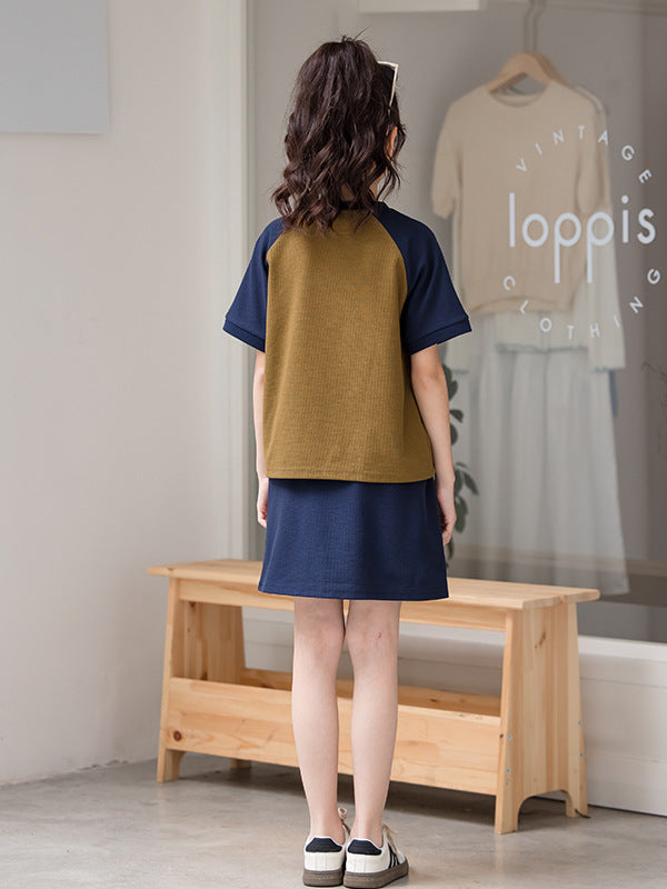 Girls color patchwork short sleeves t-shirt in vibrant green, made from soft cotton blend material, perfect for summer wear.