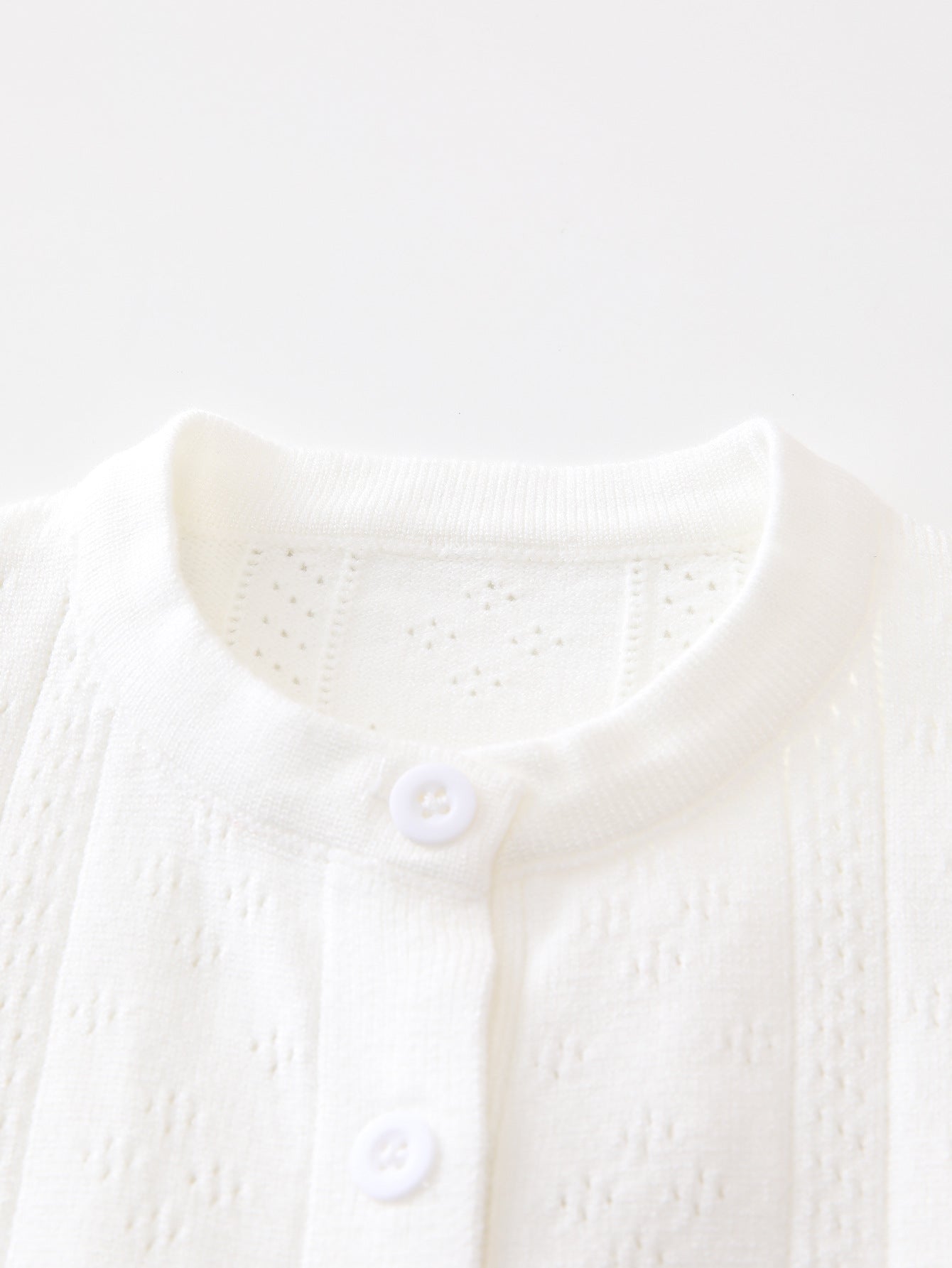 Summer New Arrival Baby Unisex Solid Color Short Sleeves in white, made from soft cotton and polyester blend, suitable for infants and toddlers.