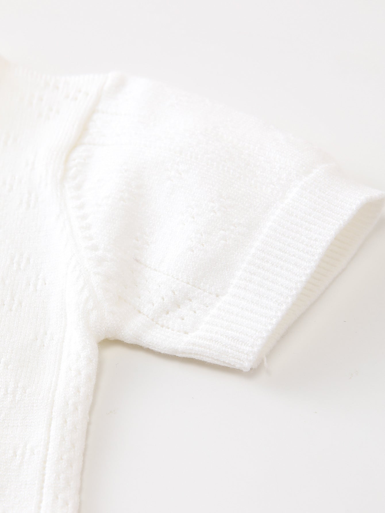 Summer New Arrival Baby Unisex Solid Color Short Sleeves in white, made from soft cotton and polyester blend, suitable for infants and toddlers.