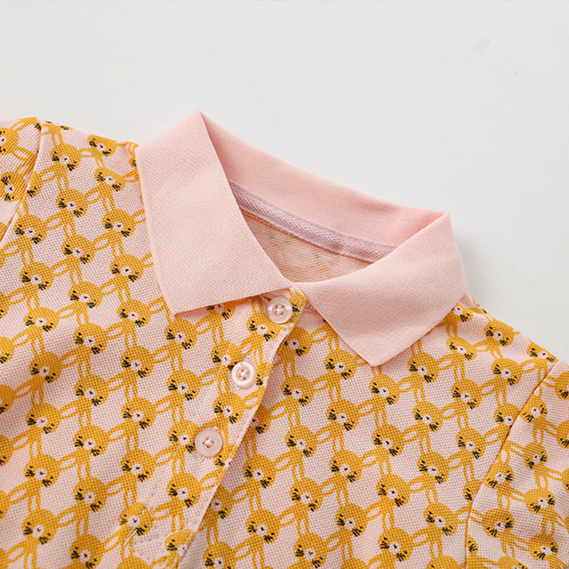 A vibrant yellow shirt for girls featuring a cute numerous rabbits pattern and a classic turn-down collar, perfect for summer wear.