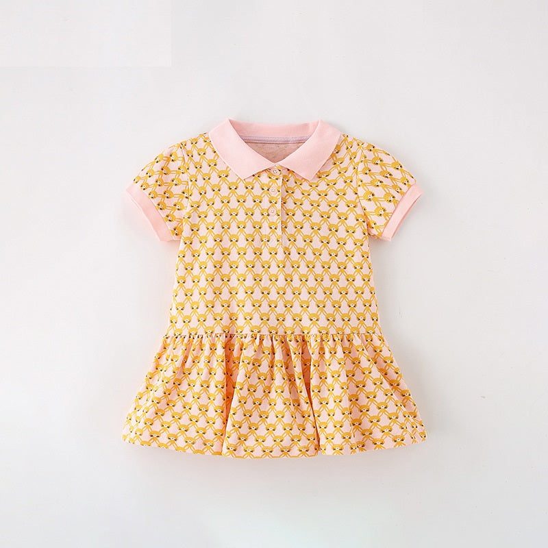 A vibrant yellow shirt for girls featuring a cute numerous rabbits pattern and a classic turn-down collar, perfect for summer wear.