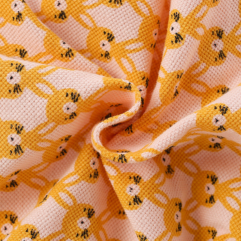 A vibrant yellow shirt for girls featuring a cute numerous rabbits pattern and a classic turn-down collar, perfect for summer wear.