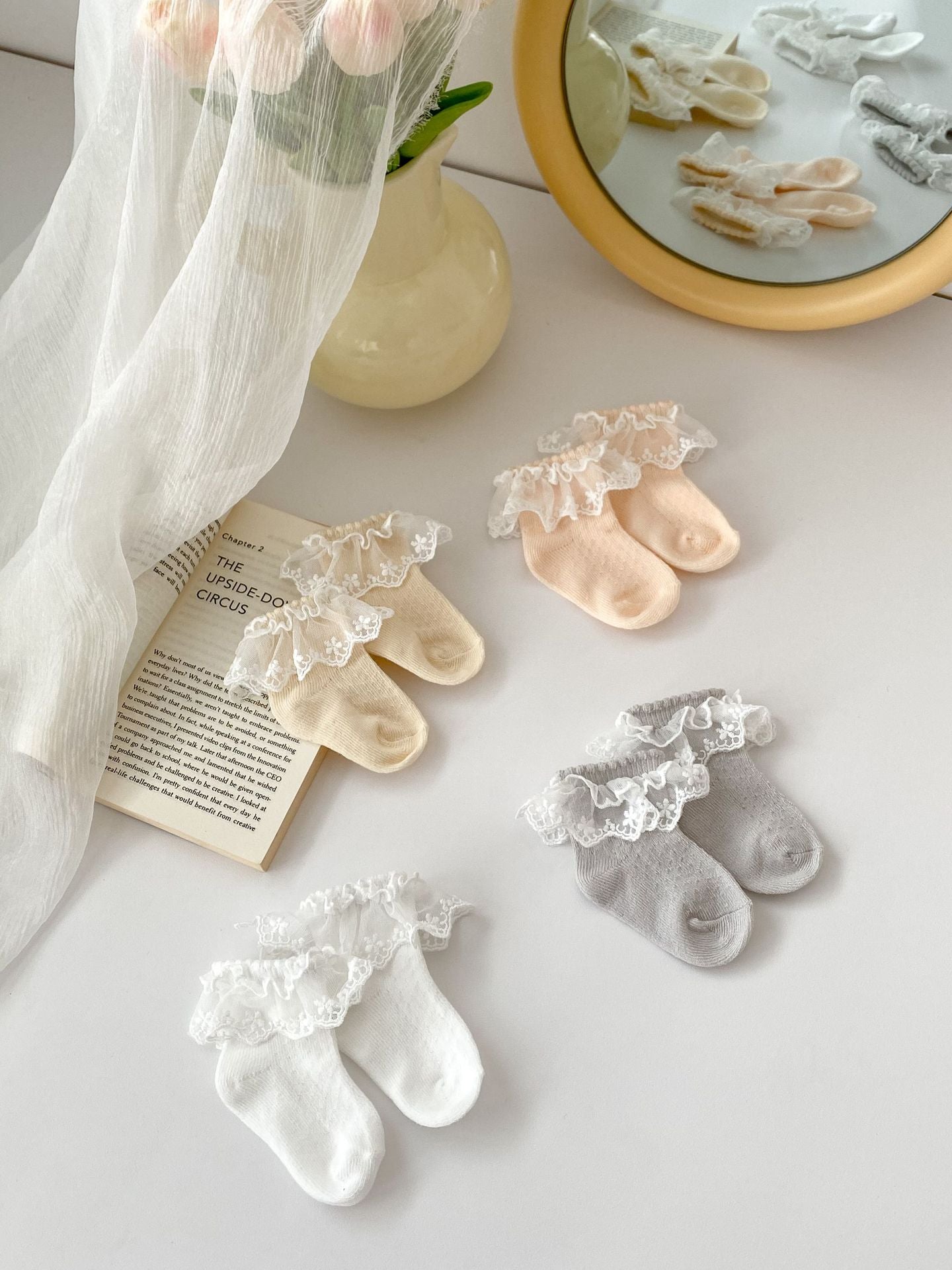 A pair of Summer Thin Breathable Mesh Socks for Girls in various colors including white, pink, and grey, designed for comfort and style.